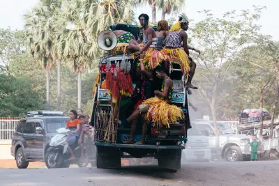 Outside U Bein Bridge in Myanmar, a truck loaded with dancers after a performance