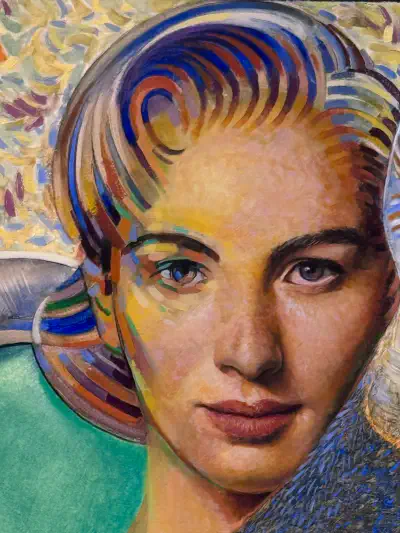 A woman with short, wavy hair faces the viewer.