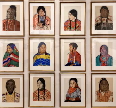 Twelve framed portraits of Blackfeet tribe members